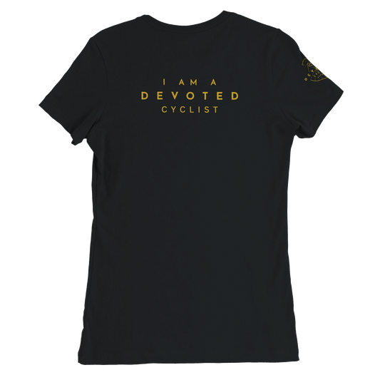 PIcture of the back of a women's Specific T-shirt in black with the words, I am a devoted cyclist "printed in gold on the back. The T-shirt is from The Devoted Cyclists and is on a transparent background. 